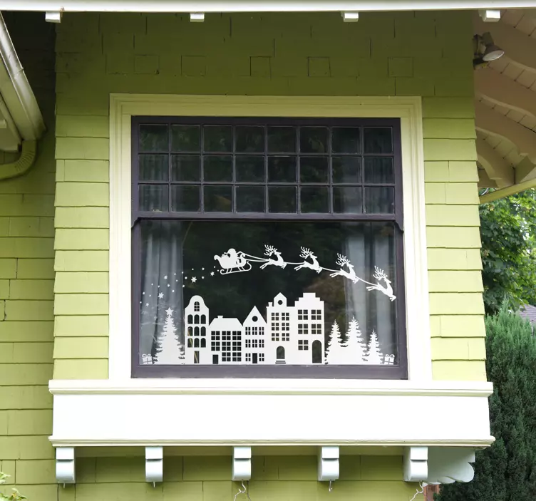 Noel evleri üzerinde uçan reindeers çıkartması - TenStickers